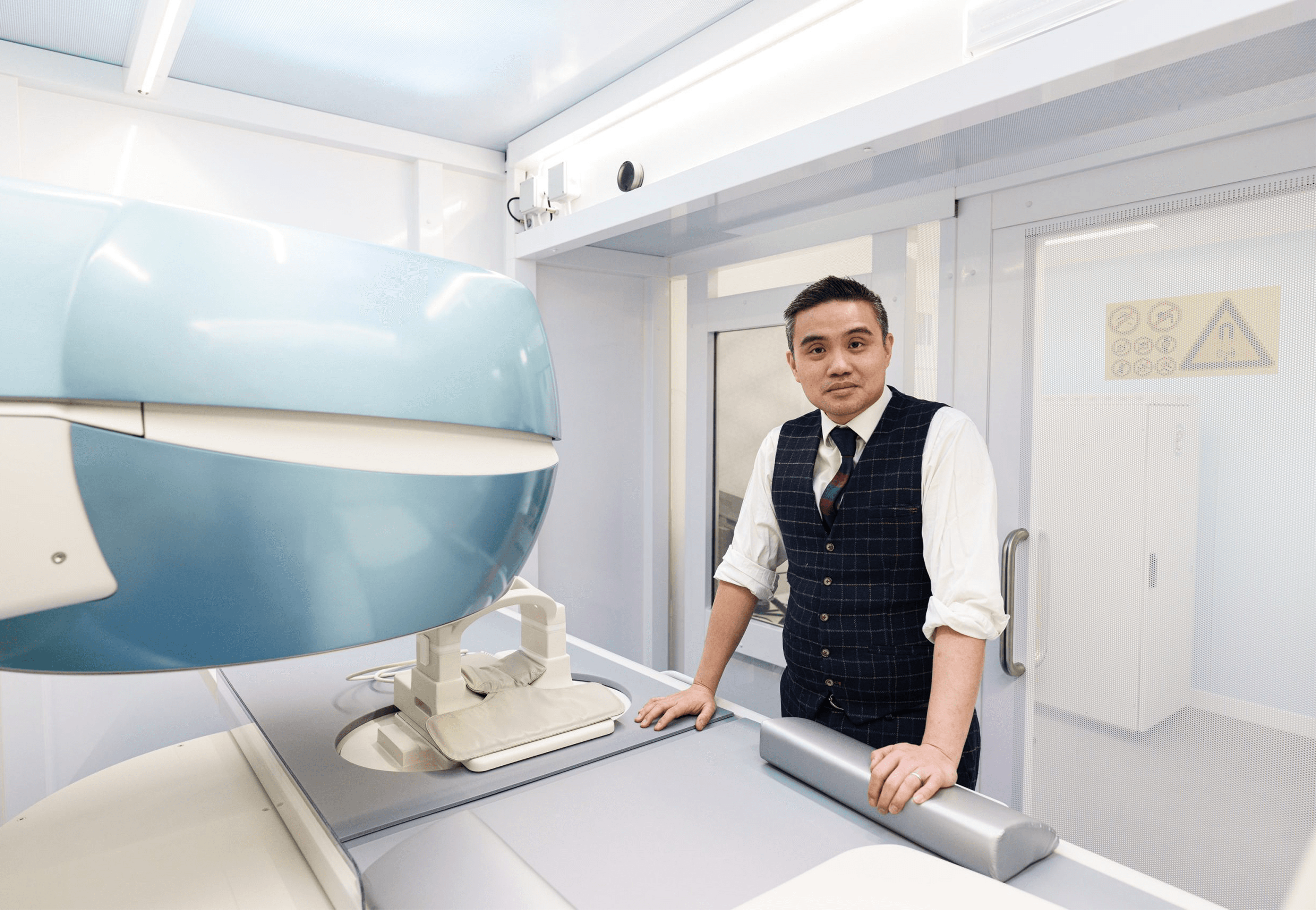 Professor Paul YF Lee reviewing MRI imaging for cartilage treatment planning